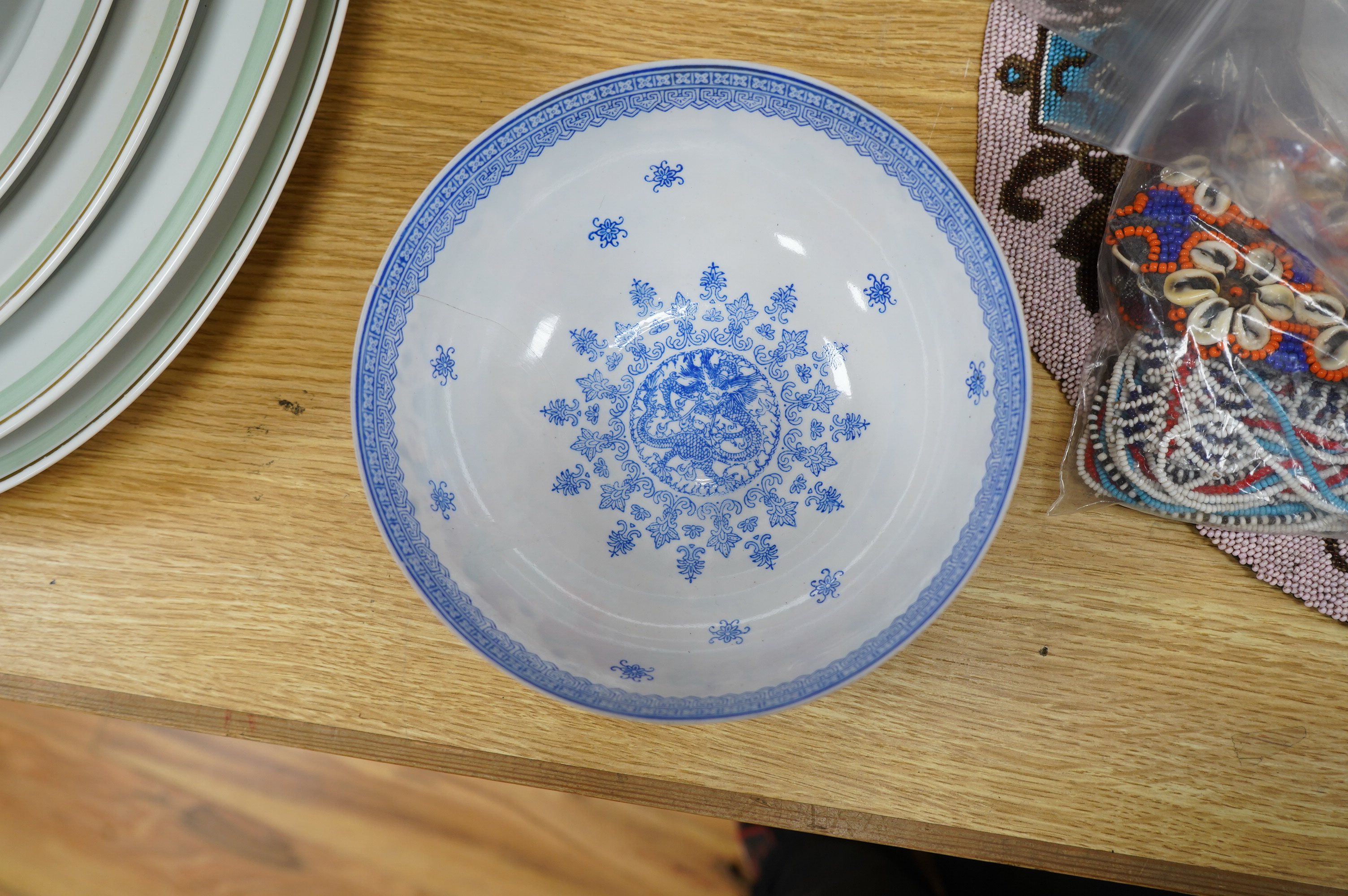 A Chinese eggshell porcelain bowl, 18cm diameter, boxed. Condition - poor, broken and partially repaired